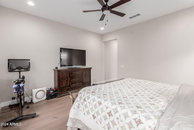 bedroom with ceiling fan and light hardwood / wood-style flooring