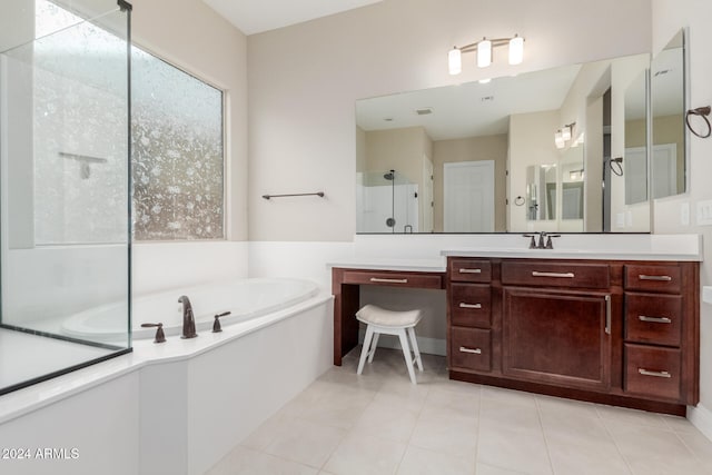 bathroom featuring separate shower and tub, tile patterned flooring, and vanity