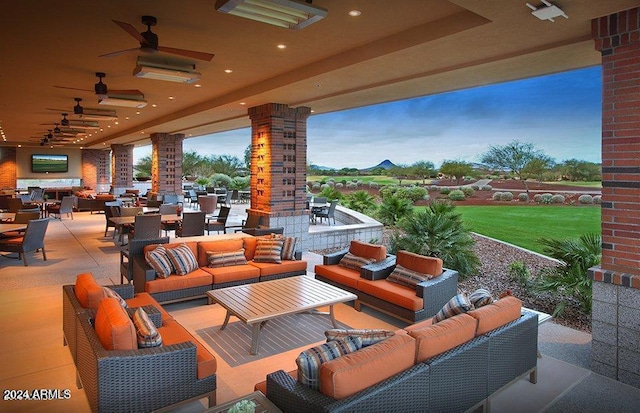 view of patio with ceiling fan and an outdoor hangout area