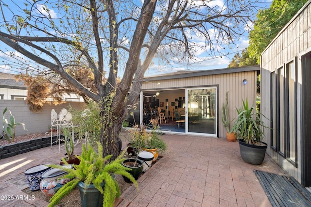 view of patio / terrace featuring fence