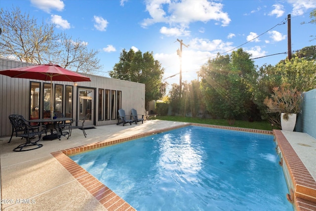 outdoor pool featuring a patio area