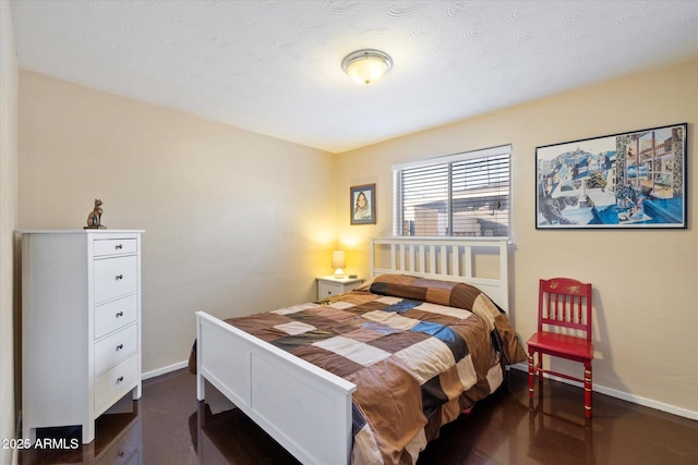 bedroom featuring baseboards