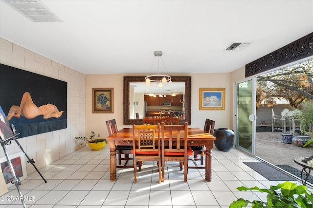 dining space featuring visible vents and light tile patterned flooring