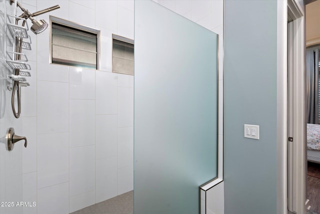 full bathroom featuring connected bathroom and a walk in shower