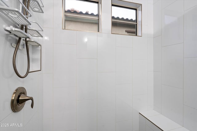 bathroom with a tile shower