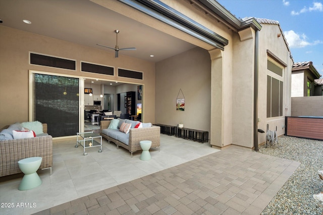 view of patio with an outdoor hangout area and a ceiling fan