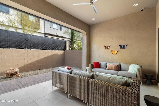 view of patio with fence, ceiling fan, and an outdoor hangout area
