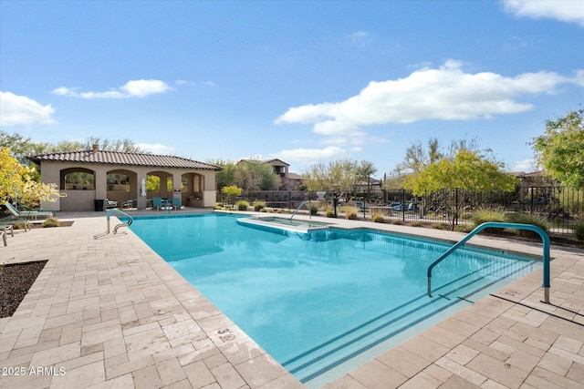 view of swimming pool with fence, a patio area, and a fenced in pool