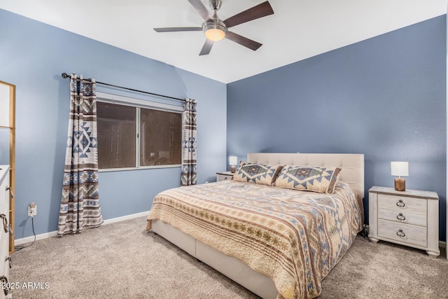 bedroom with ceiling fan and light carpet