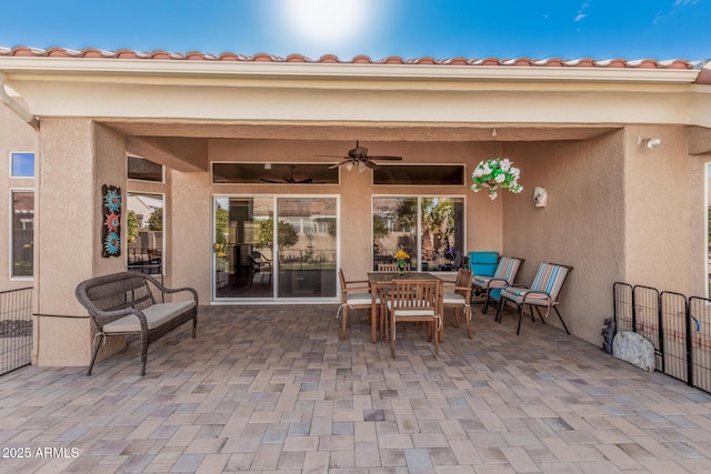 view of patio featuring ceiling fan