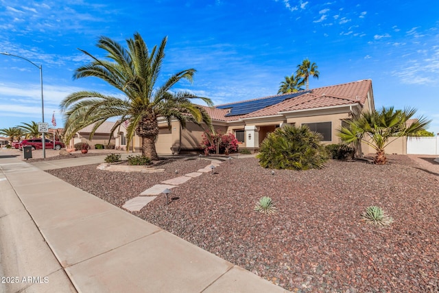 view of front of home with solar panels