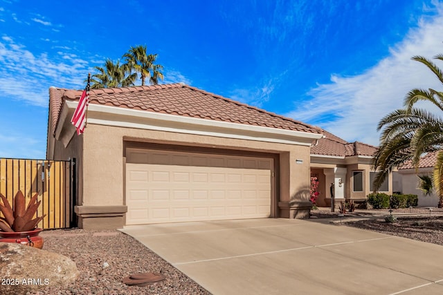 mediterranean / spanish-style home featuring a garage