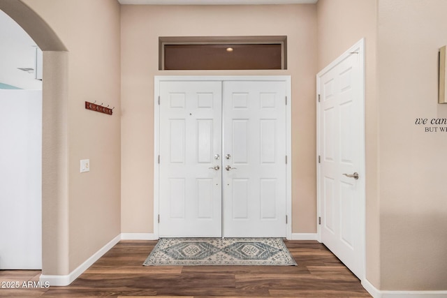 foyer with dark hardwood / wood-style floors