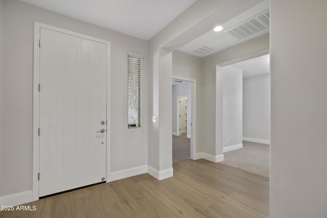 entrance foyer with light hardwood / wood-style flooring