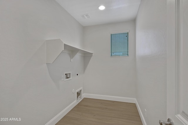 laundry room with hookup for a washing machine, hookup for a gas dryer, hookup for an electric dryer, and light wood-type flooring