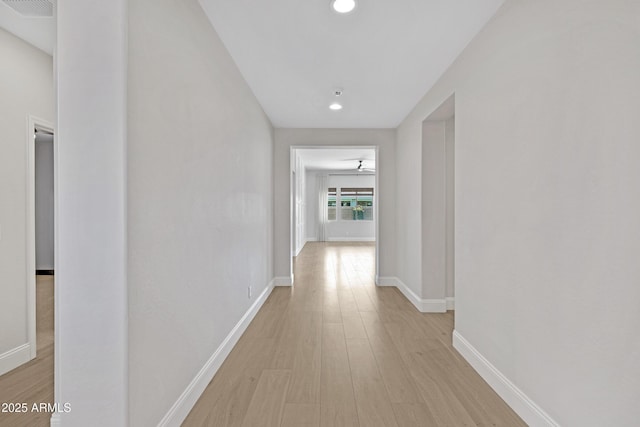 hall with light hardwood / wood-style flooring