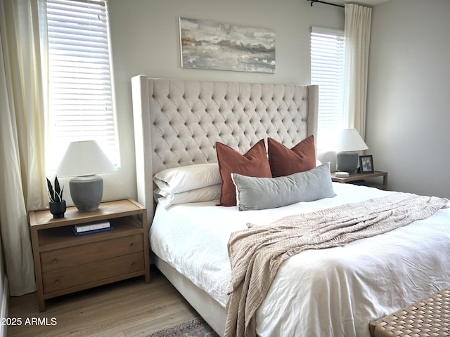 bedroom with hardwood / wood-style floors