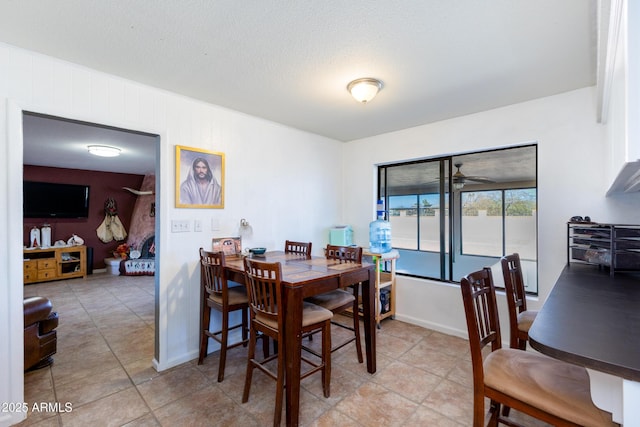 dining area with a textured ceiling