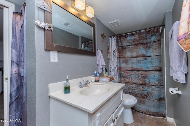 bathroom featuring vanity, toilet, and a shower with shower curtain