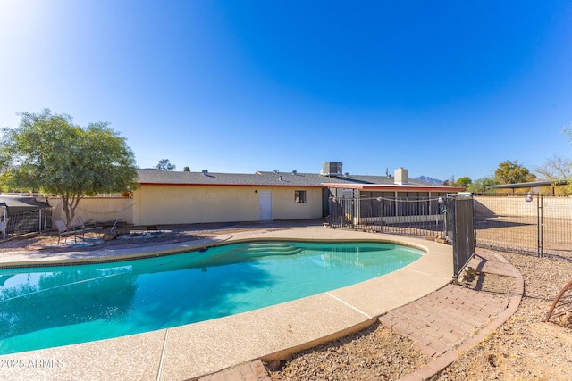 view of pool with central AC and a patio area