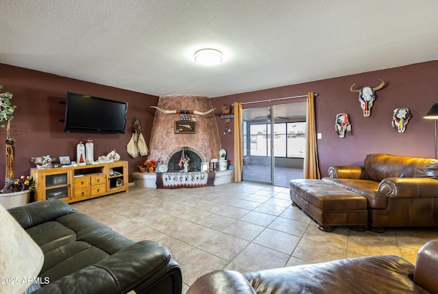 tiled living room featuring a textured ceiling and a fireplace