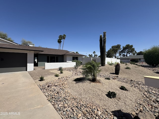 13601 N 50th Pl, Scottsdale, AZ 85254 - ranch-style home featuring concrete driveway, brick siding, and an attached garage