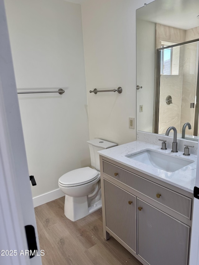 13601 N 50th Pl, Scottsdale, AZ 85254 - full bath featuring wood finished floors, toilet, vanity, and a stall shower