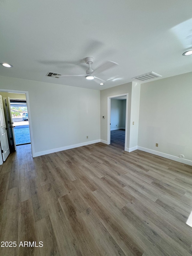 13601 N 50th Pl, Scottsdale, AZ 85254 - spare room featuring wood finished floors, baseboards, and ceiling fan