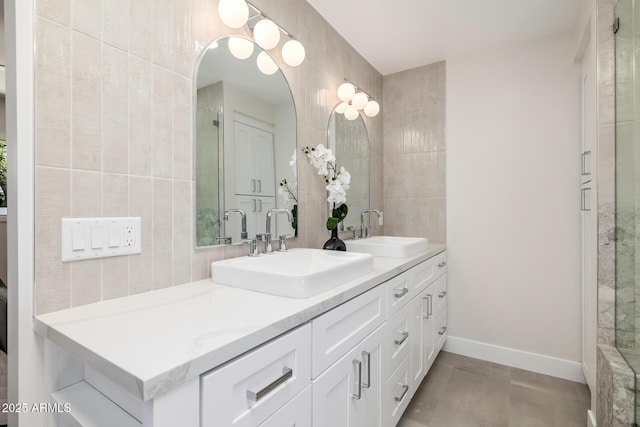 13601 N 50th Pl, Scottsdale, AZ 85254 - full bathroom featuring double vanity, tile walls, and tiled shower