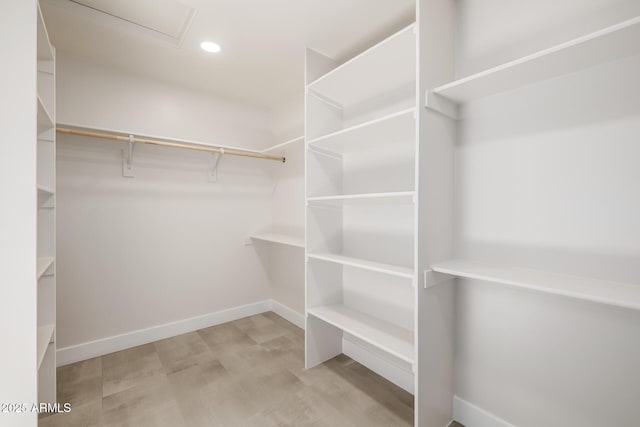 13601 N 50th Pl, Scottsdale, AZ 85254 - walk in closet featuring wood finished floors