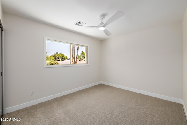 13601 N 50th Pl, Scottsdale, AZ 85254 - spare room featuring a ceiling fan, light colored carpet, and baseboards