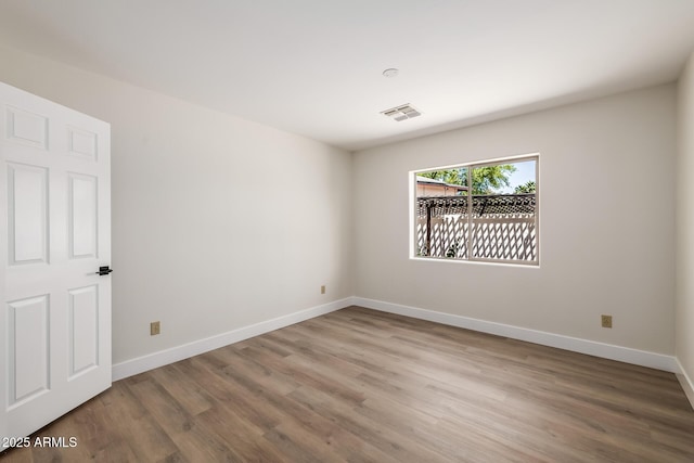 13601 N 50th Pl, Scottsdale, AZ 85254 - spare room featuring wood finished floors and baseboards