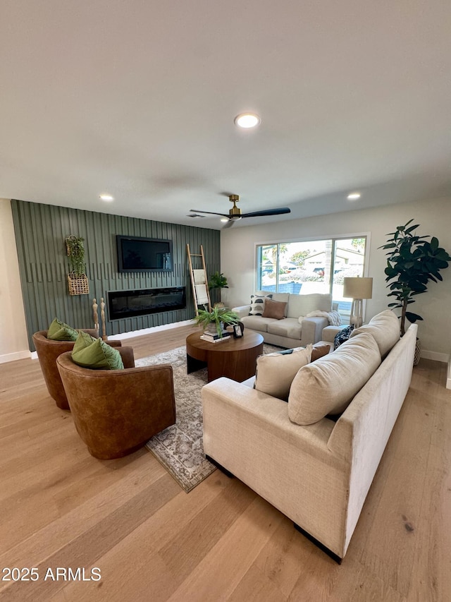 13601 N 50th Pl, Scottsdale, AZ 85254 - living area featuring light wood finished floors, baseboards, recessed lighting, ceiling fan, and a fireplace