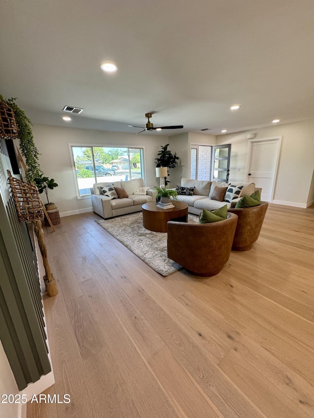 13601 N 50th Pl, Scottsdale, AZ 85254 - living area featuring baseboards, wood finished floors, plenty of natural light, recessed lighting, and a ceiling fan