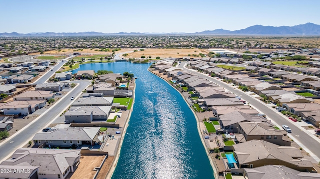 aerial view featuring a water and mountain view