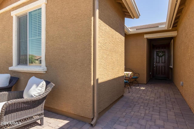 doorway to property with a patio