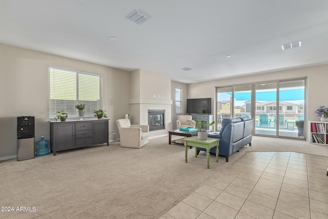 living room with light colored carpet and a wealth of natural light