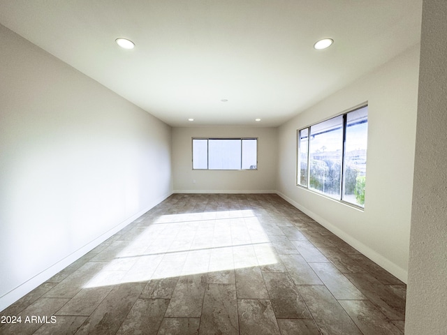 empty room with light hardwood / wood-style flooring