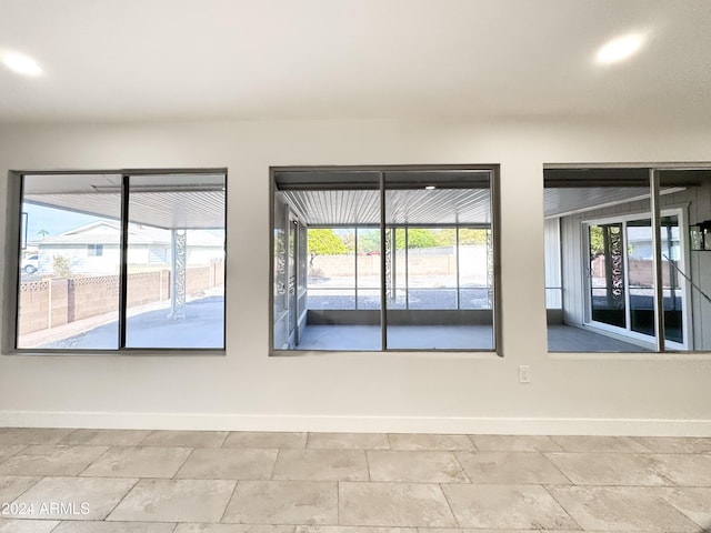 spare room featuring plenty of natural light