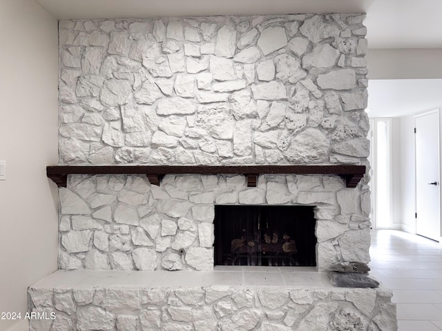 interior details featuring a fireplace and hardwood / wood-style floors