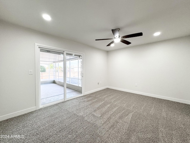 carpeted empty room featuring ceiling fan