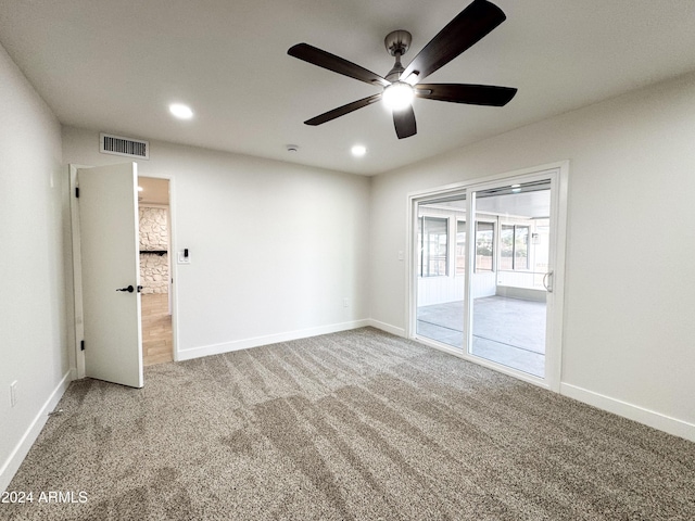 unfurnished room with carpet and ceiling fan