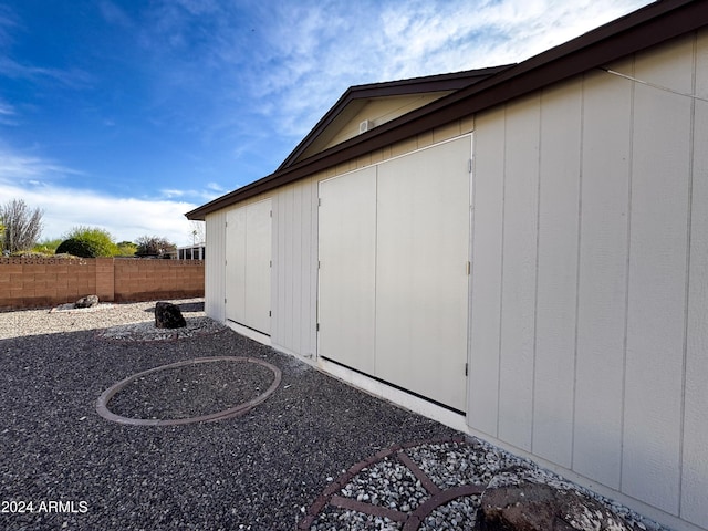 view of side of property with a shed