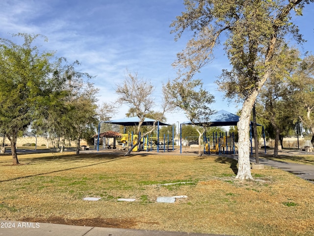 view of home's community featuring a gazebo, a playground, and a lawn