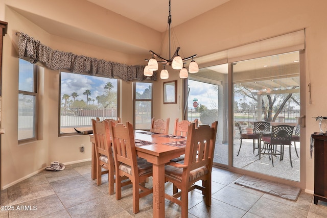 dining space featuring a notable chandelier