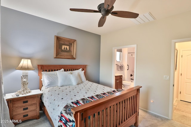 carpeted bedroom featuring ceiling fan and ensuite bathroom