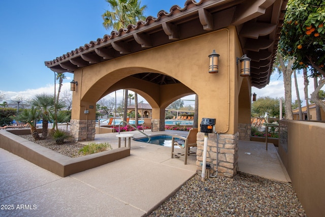 view of patio with a community pool