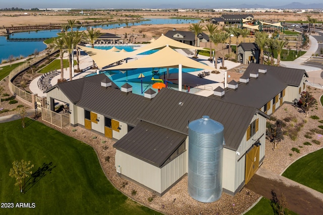 birds eye view of property featuring a water view