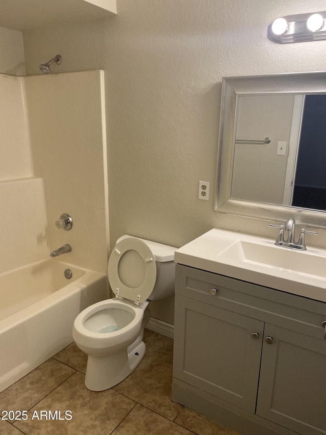 full bathroom featuring vanity, shower / tub combination, tile patterned floors, and toilet