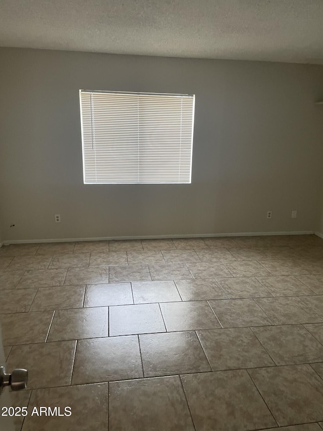 empty room with a textured ceiling